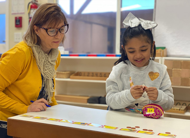Montessori Schools of California teacher working with daycare child
